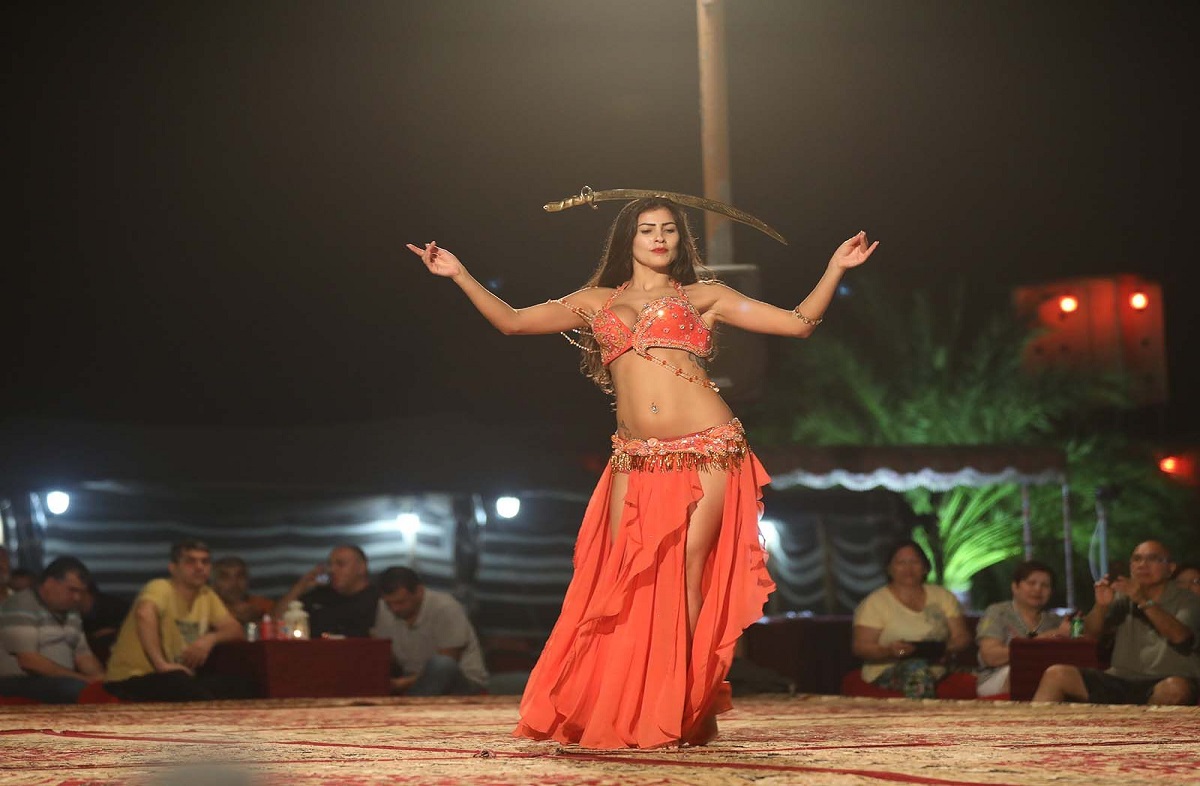 Tourists Enjoying Belly Dance Show During Desert Safari Dubai